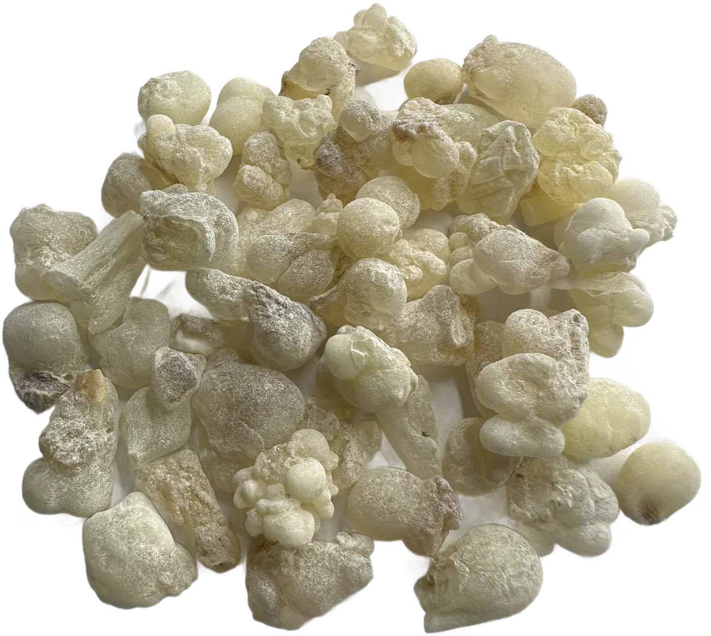 A pile of pale yellow-white Hojari frankincense tears